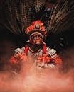 Vibrant portrait of a tribal leader in ceremonial clothing with feathered headdress, Brazil.